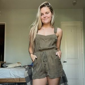 Green shorts overalls.